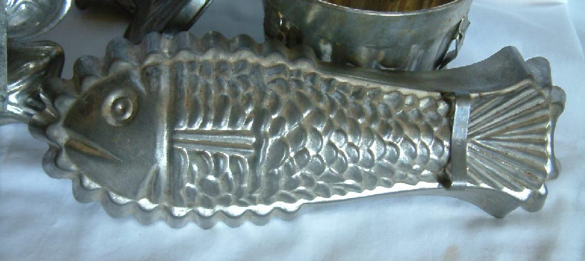 collection of vintage tin baking cooking moulds